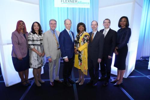Eight people pose together at the Beyond Flexner Conference