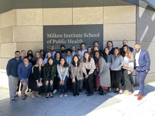 Group posing in front of the GW Milken Institute of Public Health